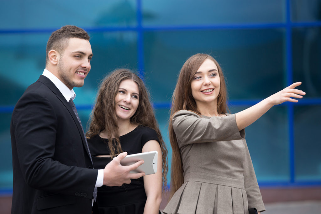 Business woman meeting with clients or partners on the street